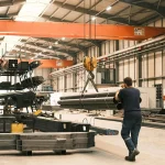 image of a manufacturing plant with heavy equipment, tools and fixtures.