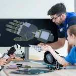 team testing a robotic arm in manufacturing
